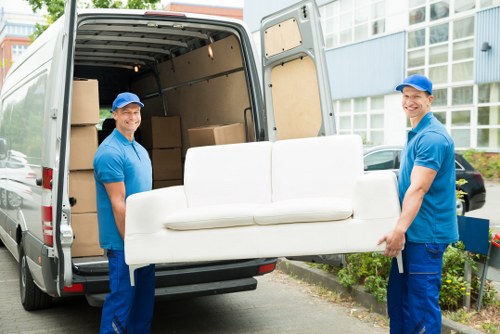 Man and van service completing delivery and unloading items
