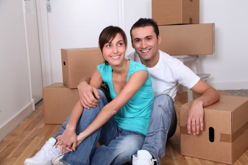 Collection team removing bulky furniture from a Kensington property