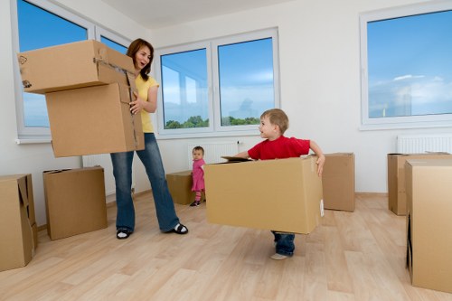 Removal team handling furniture through a Kensington apartment building