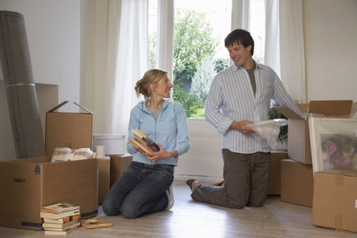 Moving team handling bulky furniture in Kensington