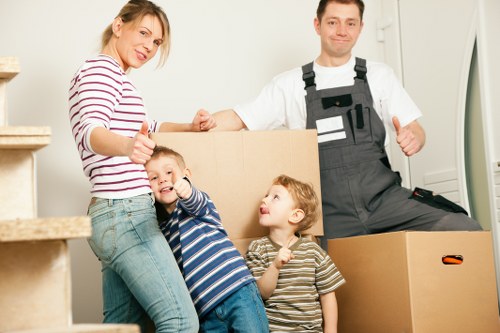 Packed boxes and labeled furniture for a commercial move